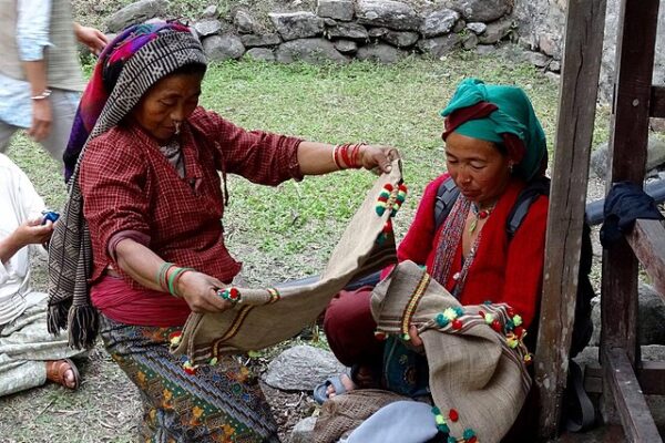 Rai_womens_Showing_their_spinning_traditional_Fenga_waistcoat_made_from_Nettle_fibre
