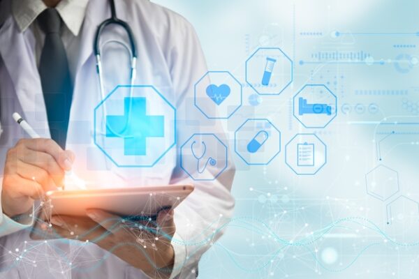 Doctor,Using,Tablet,Surrounded,By,Futuristic,Medical,Icons,,Symbolizing,Digital