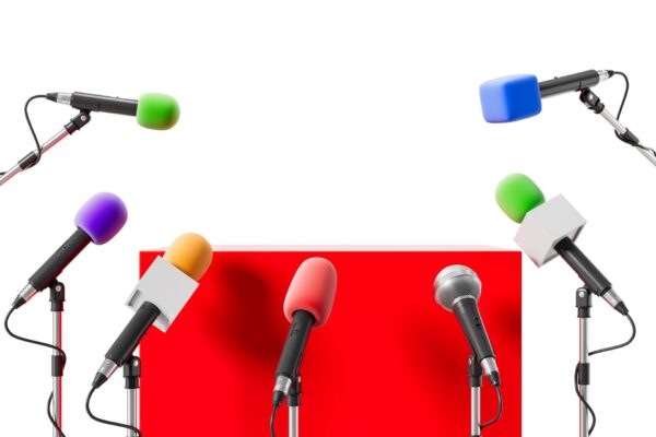 Multiple,Colorful,Microphones,On,Stands,Surround,A,Red,Podium,,White